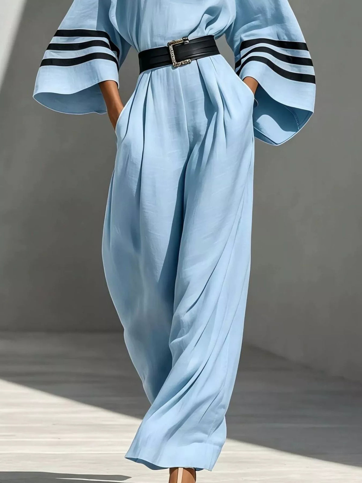 Light blue wide-sleeve jumpsuit with striped trim, pants detail.