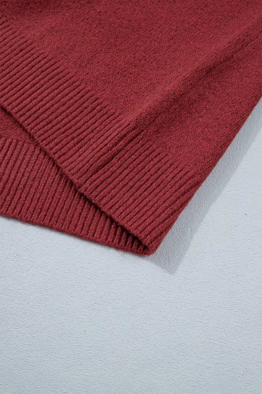 Burgundy Christmas geometric sweater, ribbed hem detail