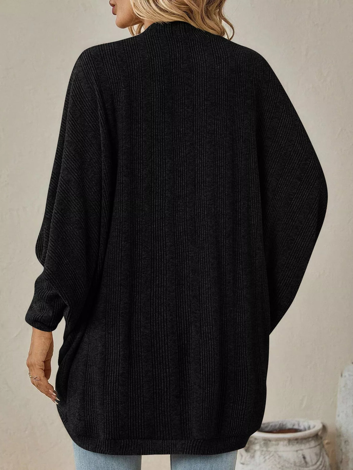 Black open-front batwing sleeve cardigan, back view