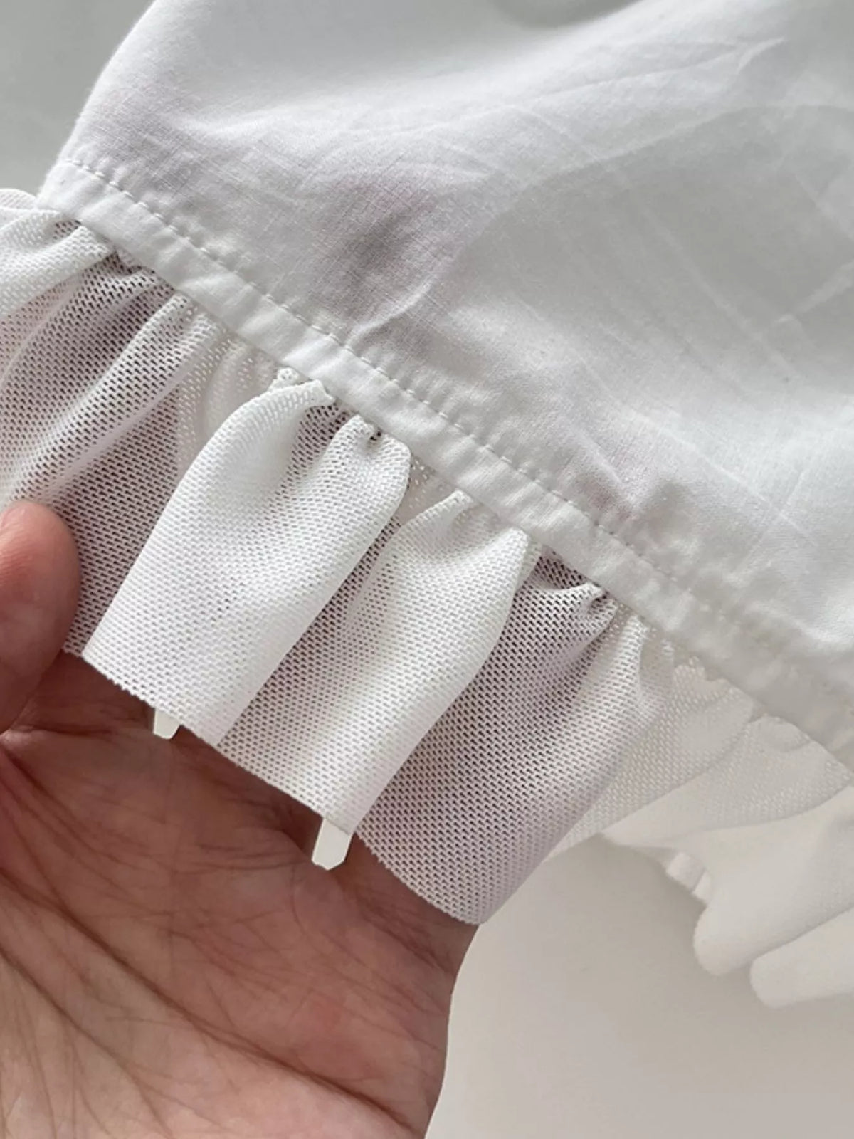 Women's Ruffled Square Neck Tiered Maxi Dress in white — hem detail view