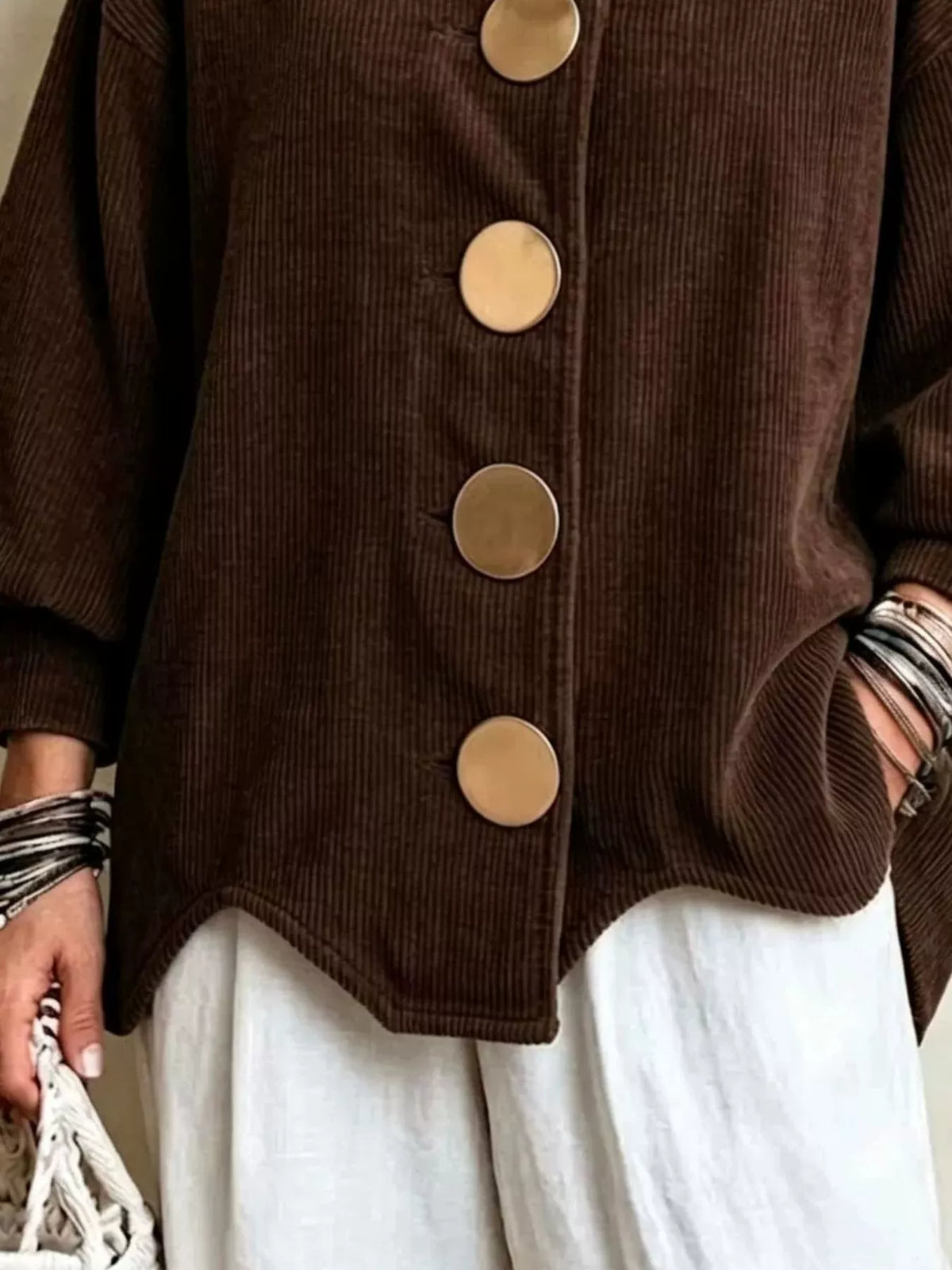 Brown corduroy button-down jacket, buttons, side pocket, and curved hem