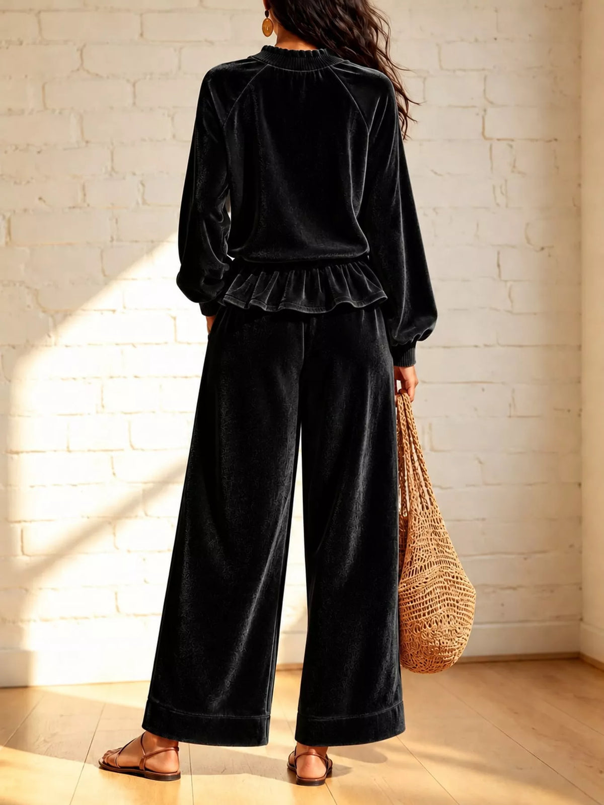 Black velvet ruffled hem top and wide-leg pants set — back view