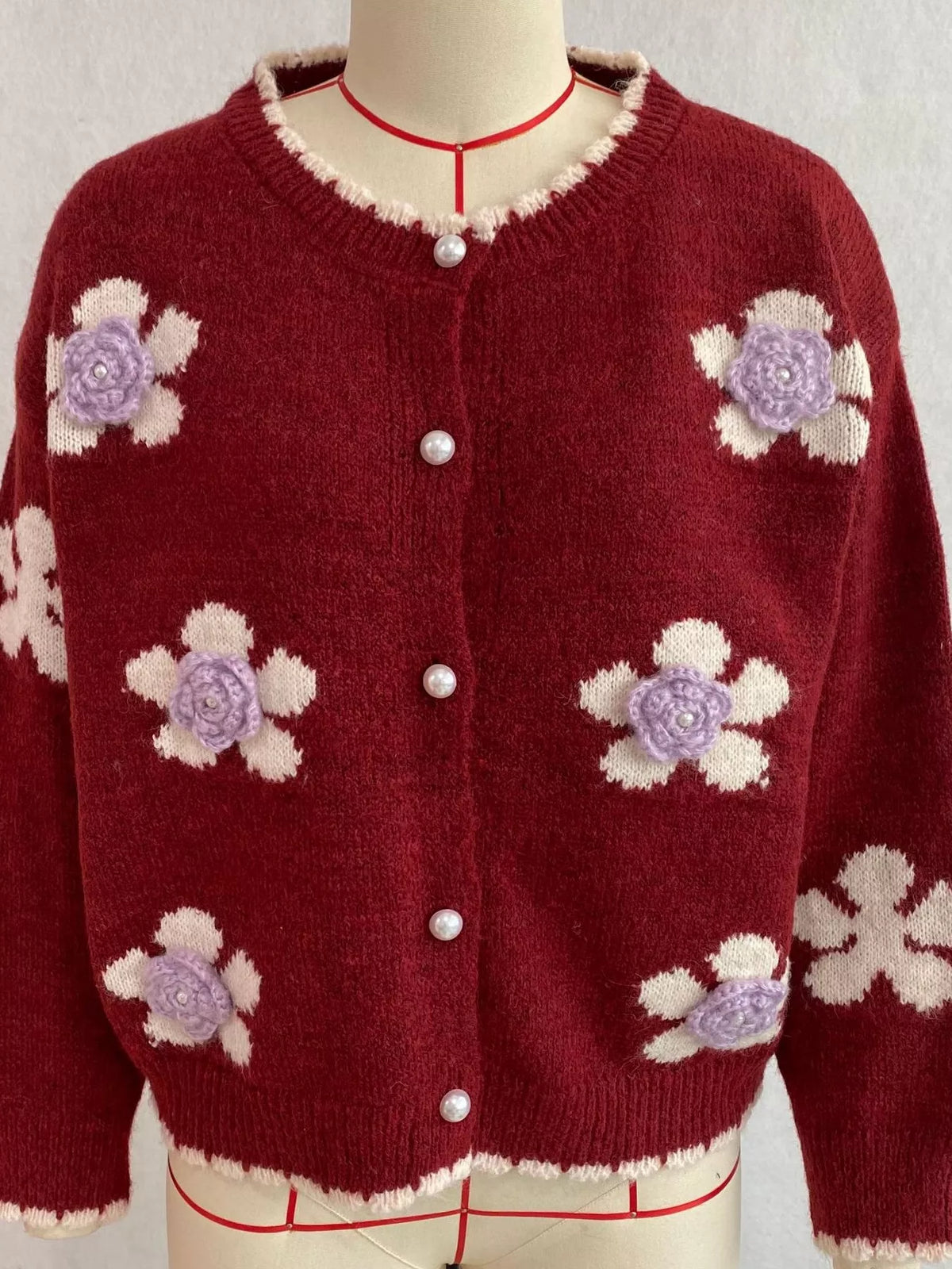 Floral-applique knit cardigan in burgundy, mannequin front view