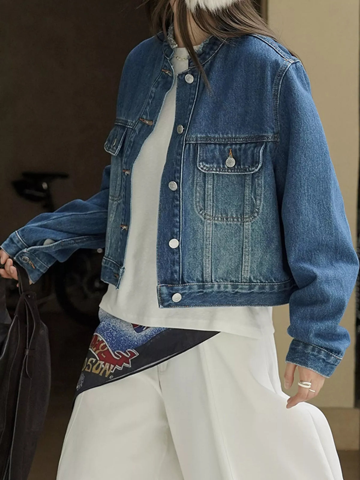 Blue button-up cropped denim jacket — side view