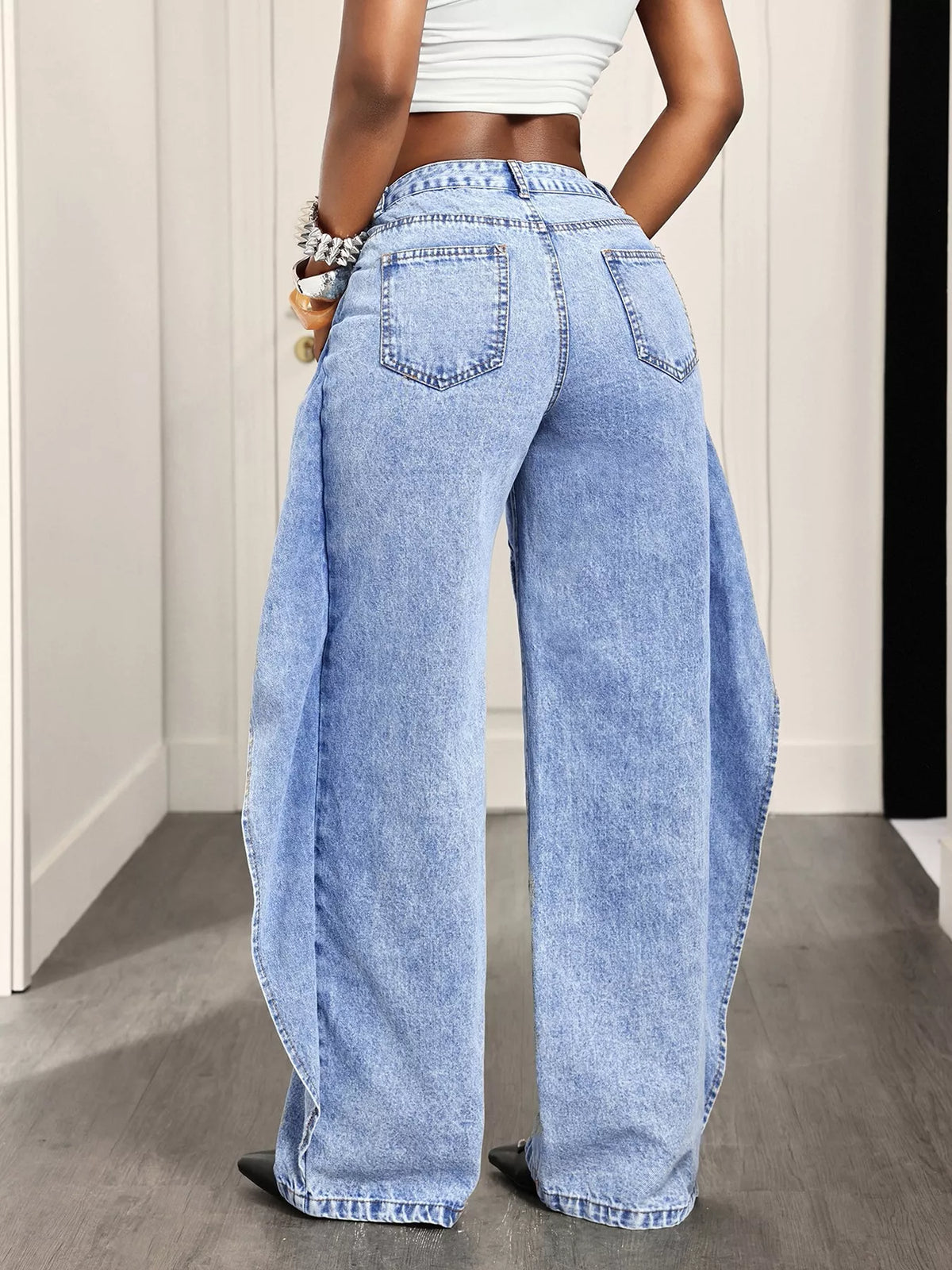 Light blue ruffled wide-leg jeans, back view