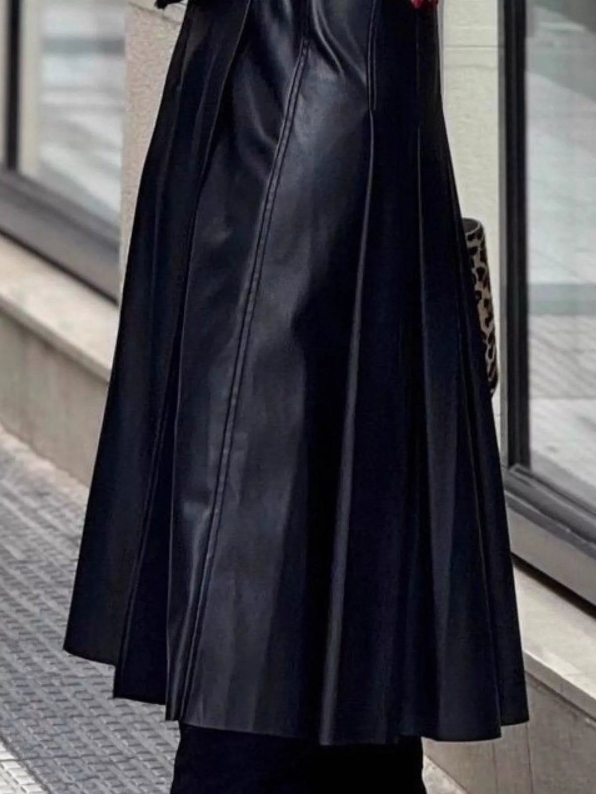 Buckle-detail faux-leather midi skirt — black side and pleated panels