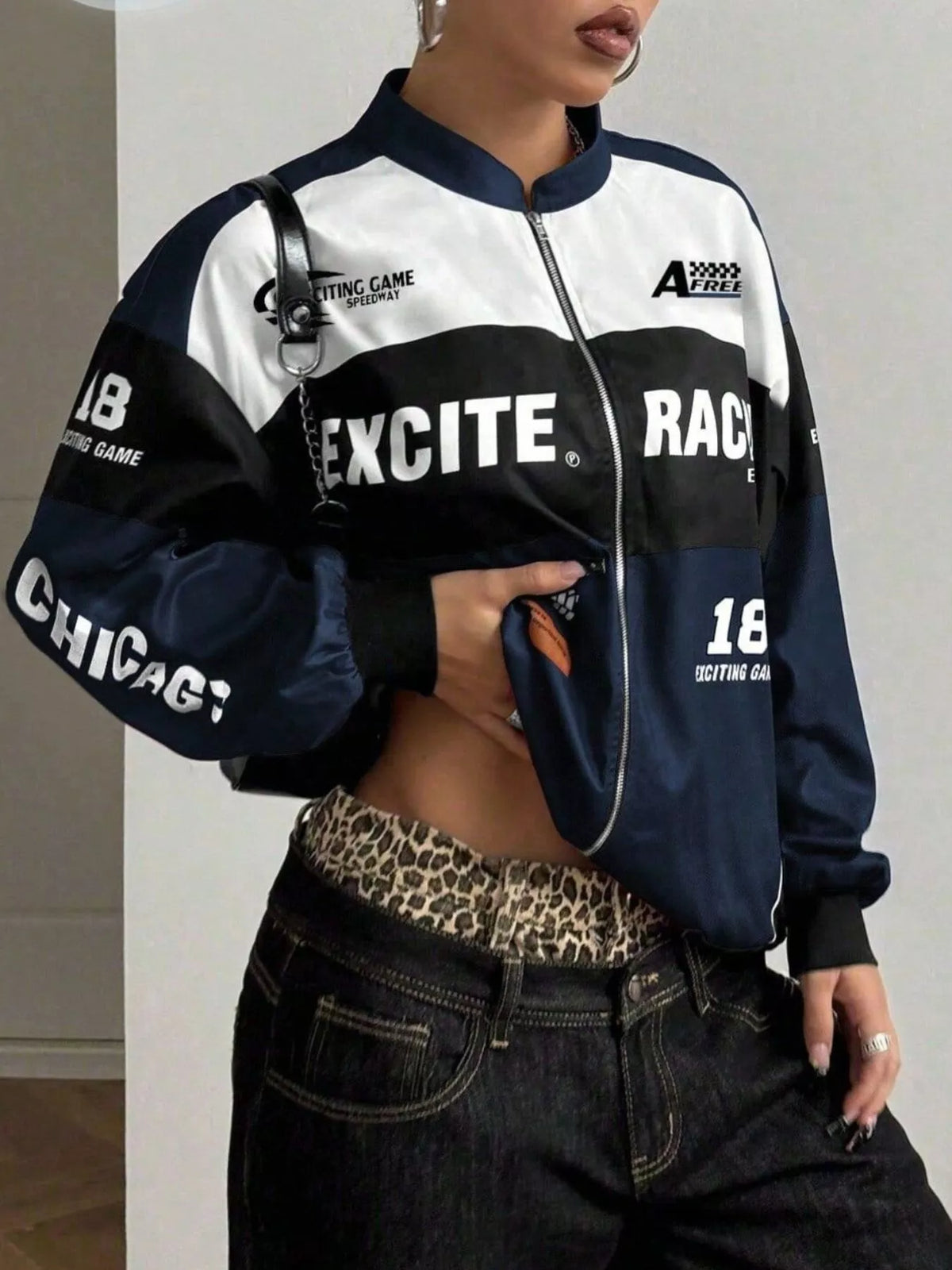 Navy and white letter-print zip-front jacket, partly zipped front view