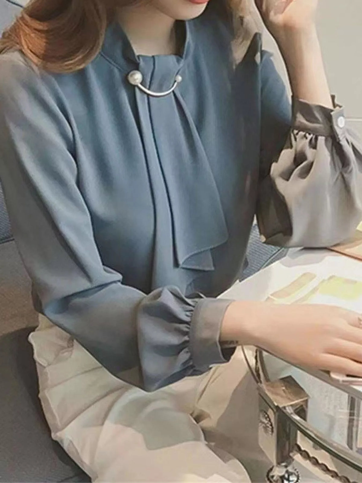 Mock Neck Blouse with Pearl Accent and Lantern Sleeves, detail view in blue