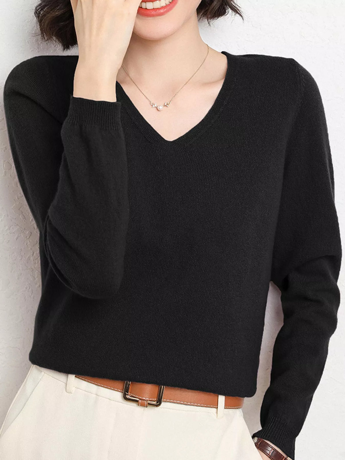 Black v-neck long sleeve knit top