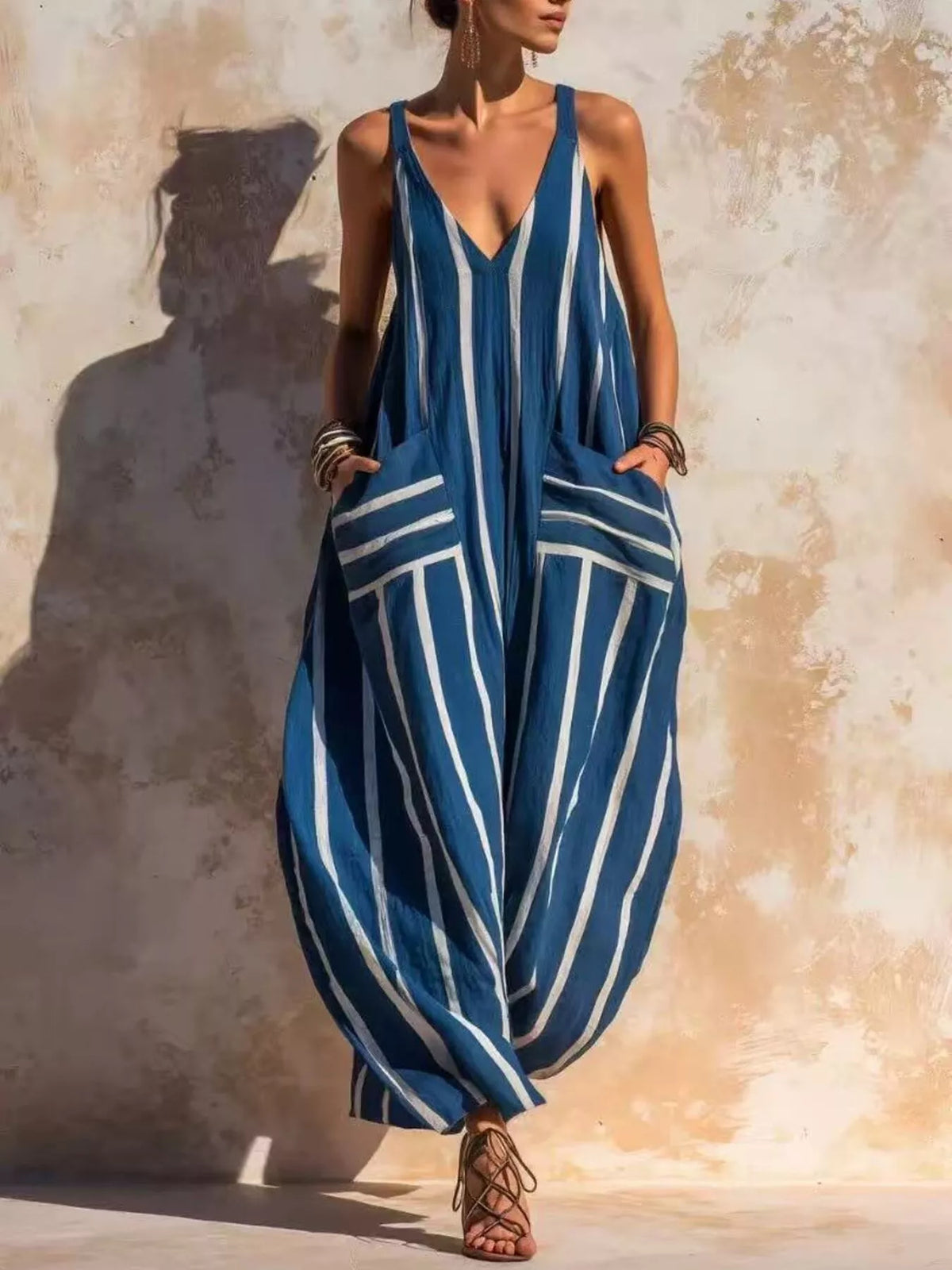 Blue and white striped sleeveless jumpsuit, full front view