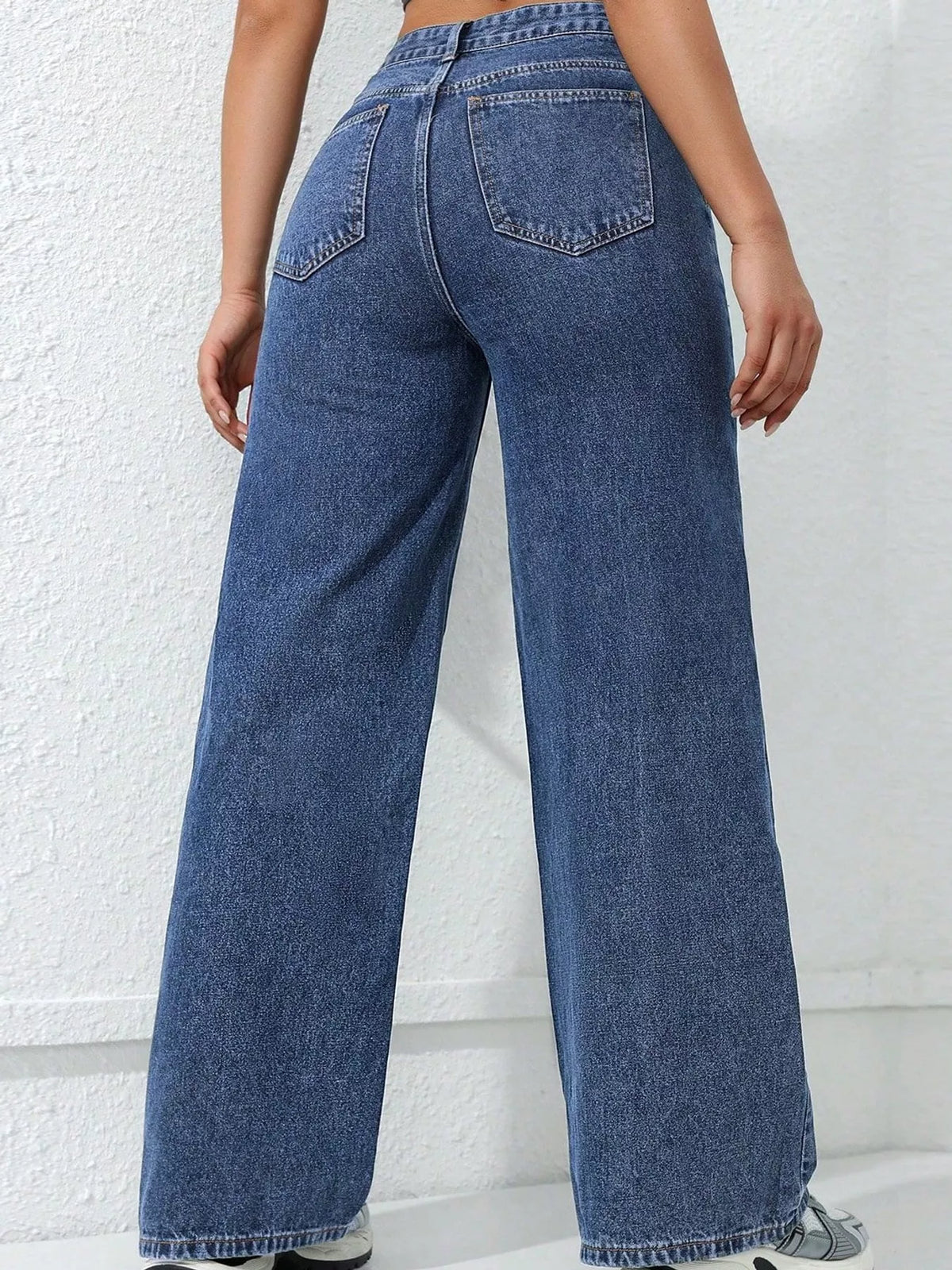 Blue high waisted wide leg jeans, back view