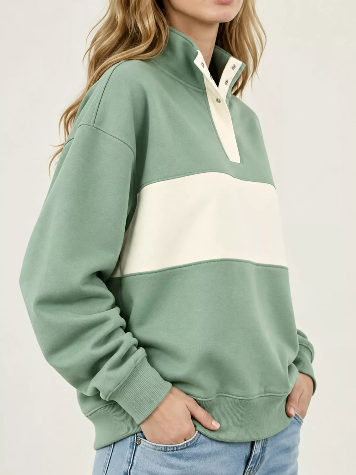 Green and cream color block snap-button sweatshirt, side view