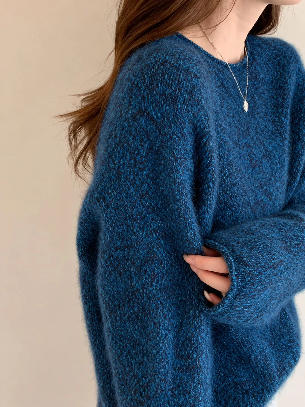 Round neck long sleeve sweater, side view