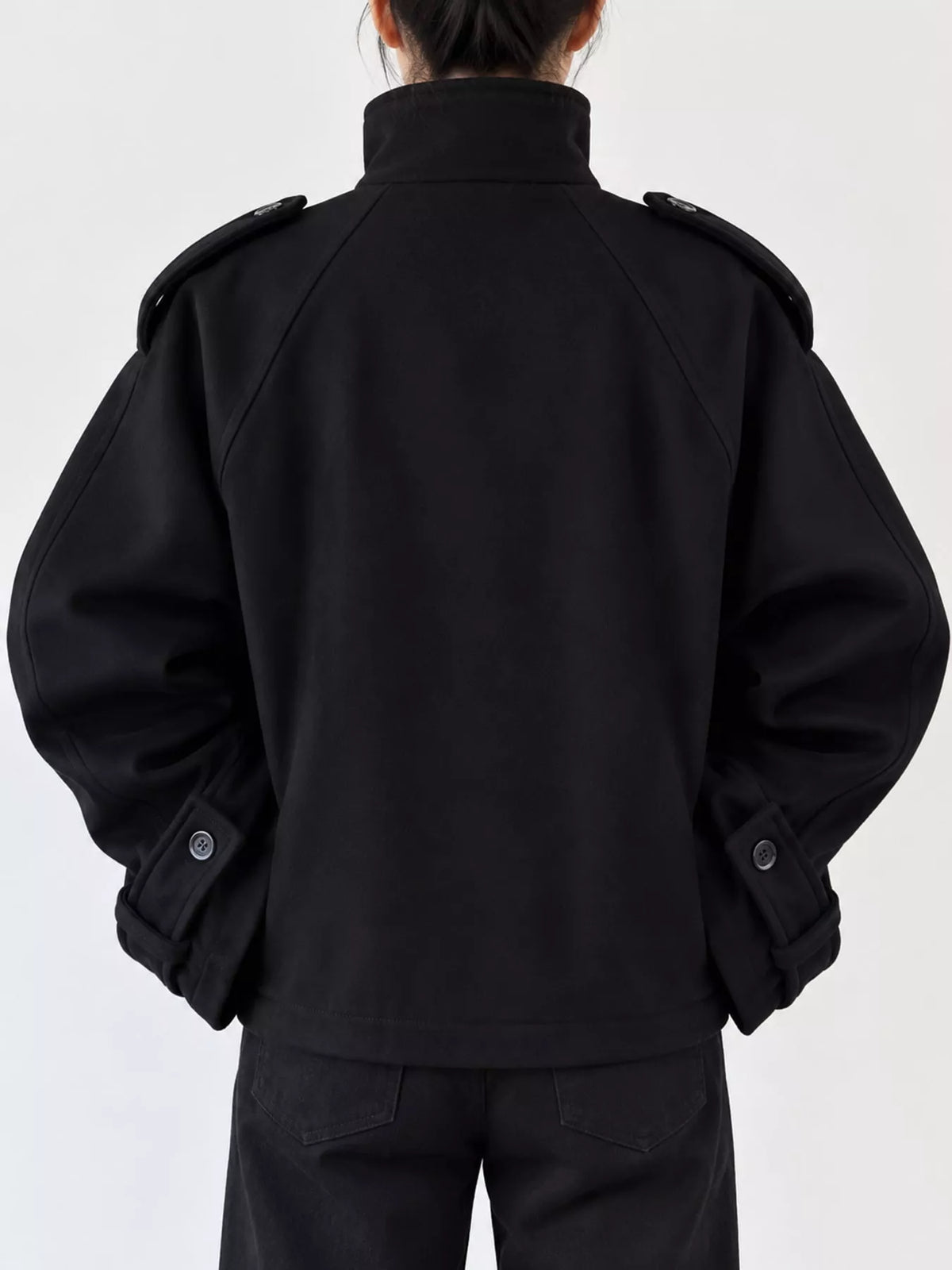 Black zip-up stand-collar jacket — back view