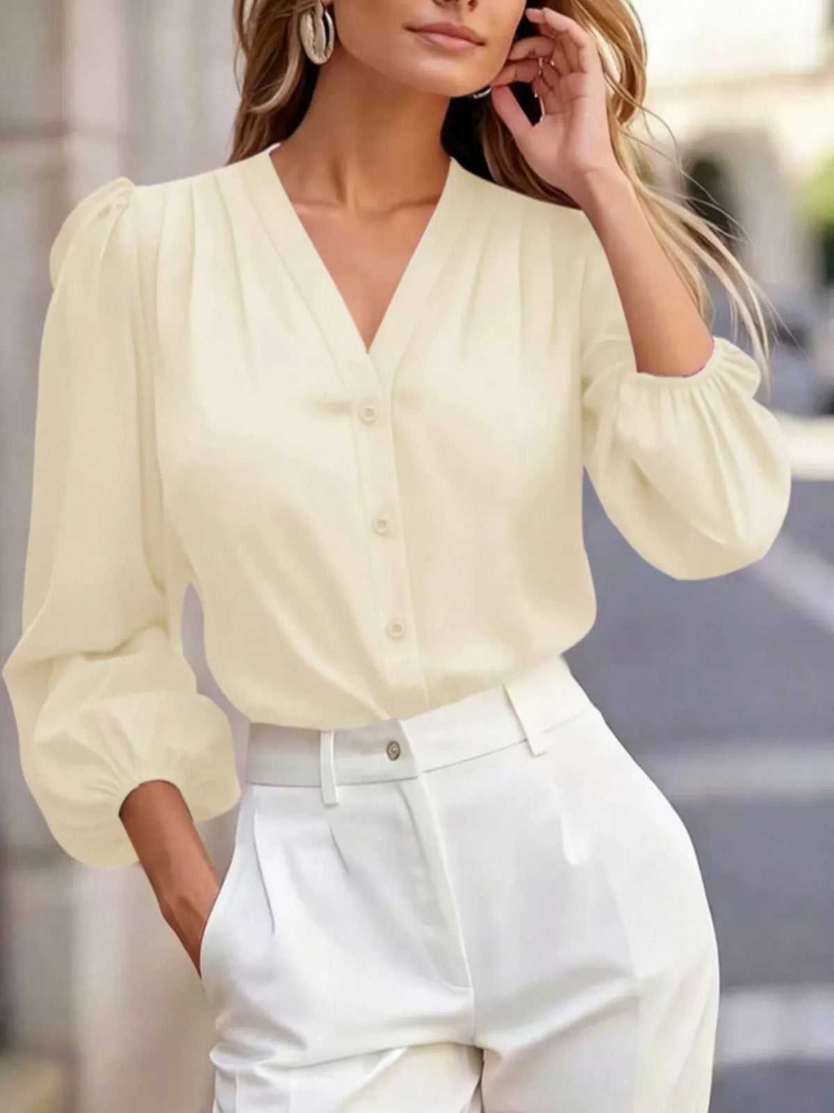 V-neck puff-sleeve button-down shirt in apricot, raised-arm front view