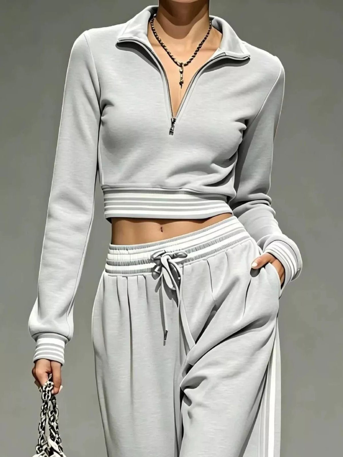 Gray half-zip crop top and pants set, zip neckline and waist detail