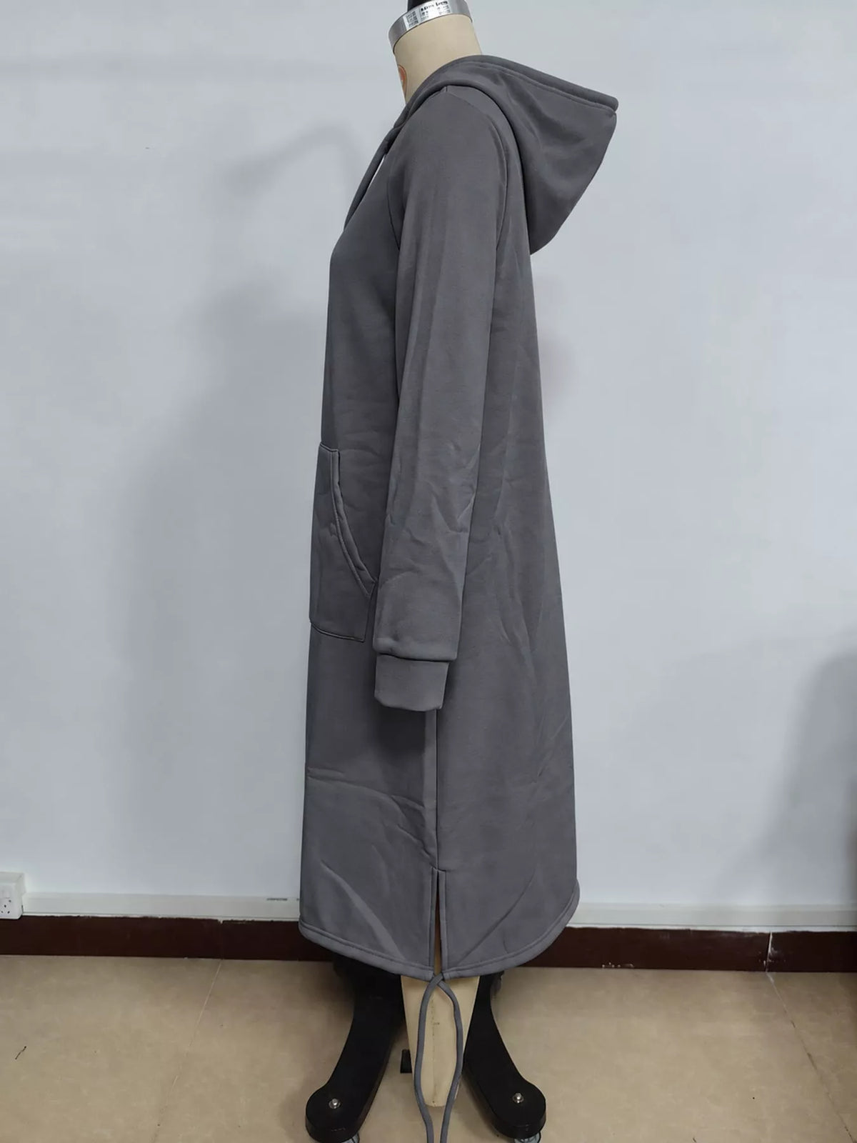 Gray hooded sweatshirt midi dress with drawstring hem, side view