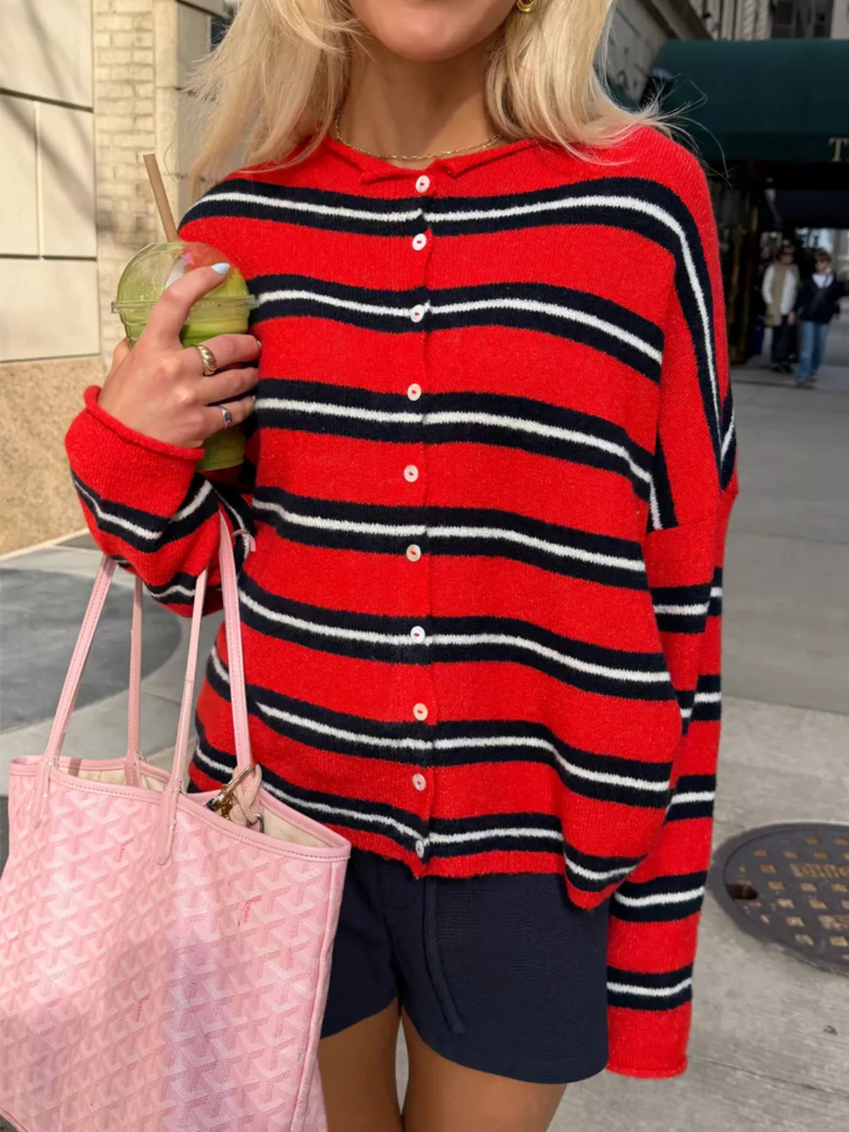 Red and black striped button-front cardigan, button-front close-up