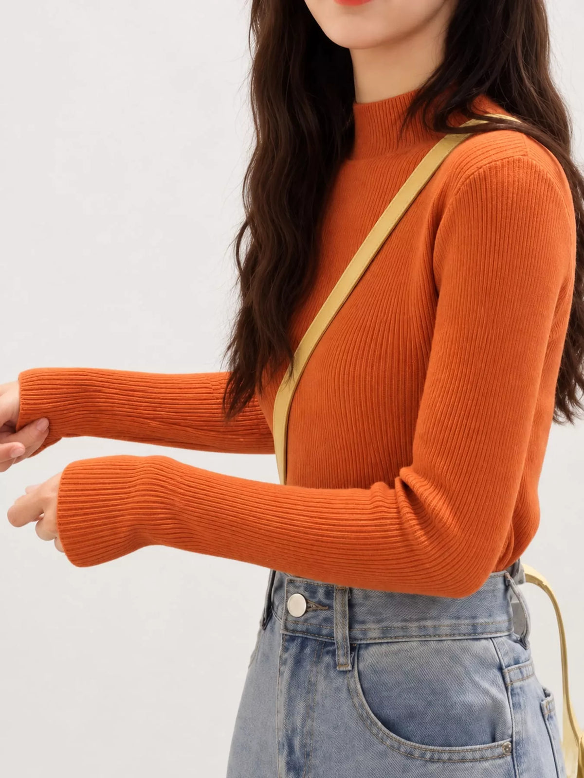 Orange ribbed mock neck long sleeve knit top