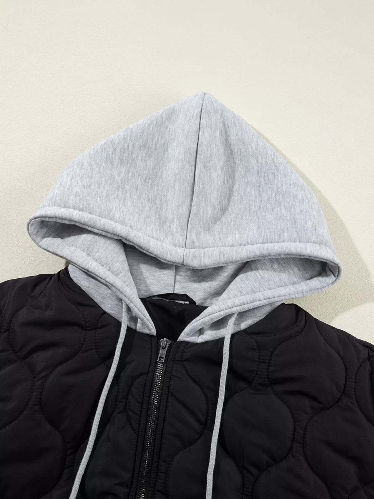 Hooded puffer vest, gray hood front