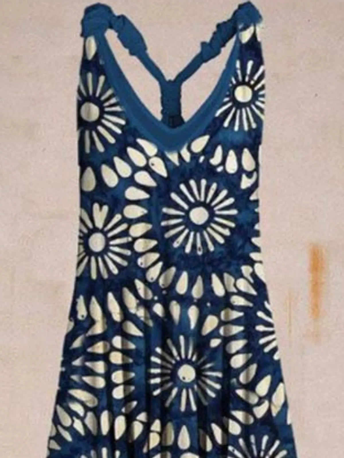 Navy and cream floral-print V-neck sleeveless jumpsuit, neckline and strap detail