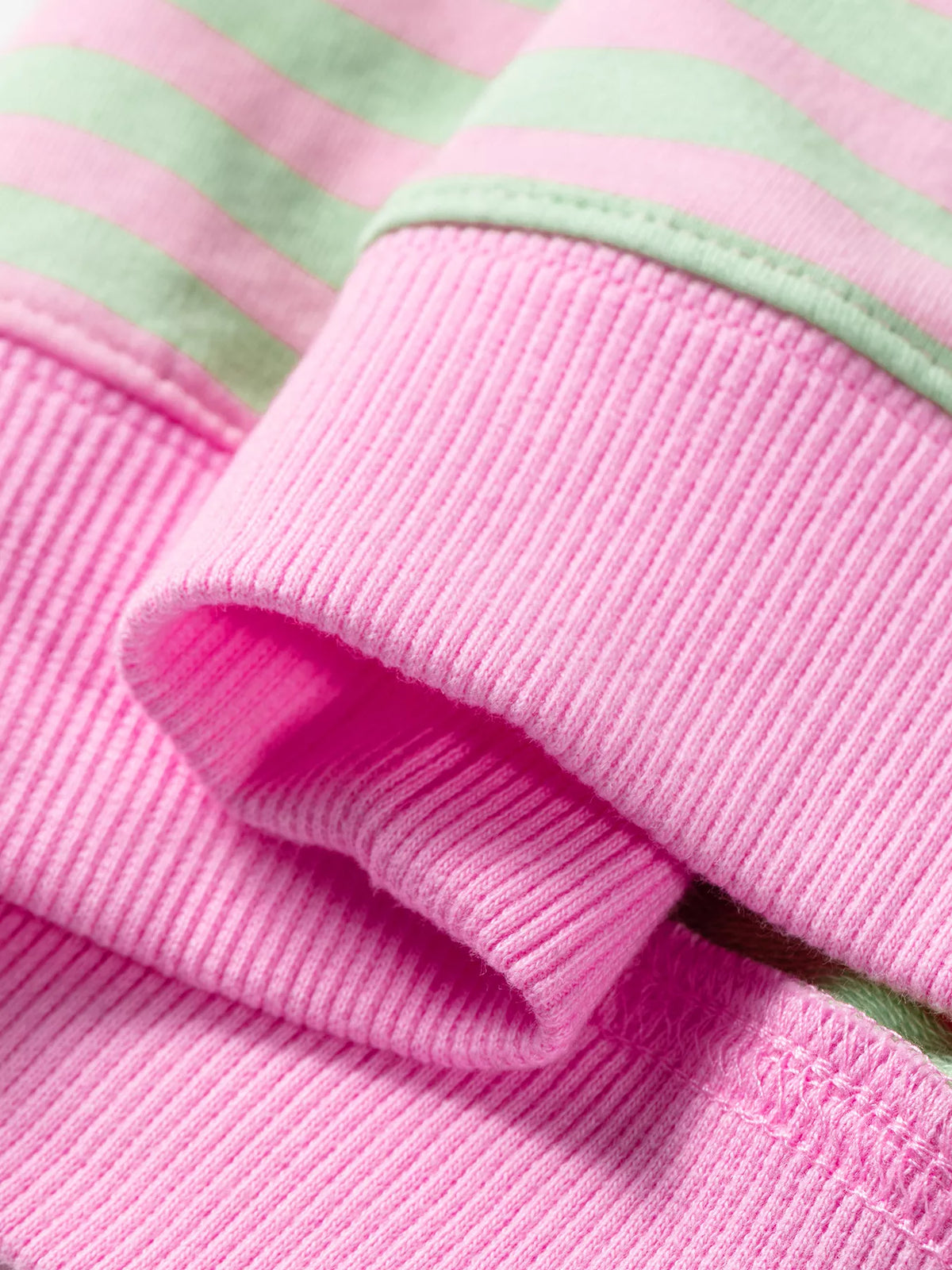 Striped Round Neck Long Sleeve Sweatshirt in pink and green, hem detail