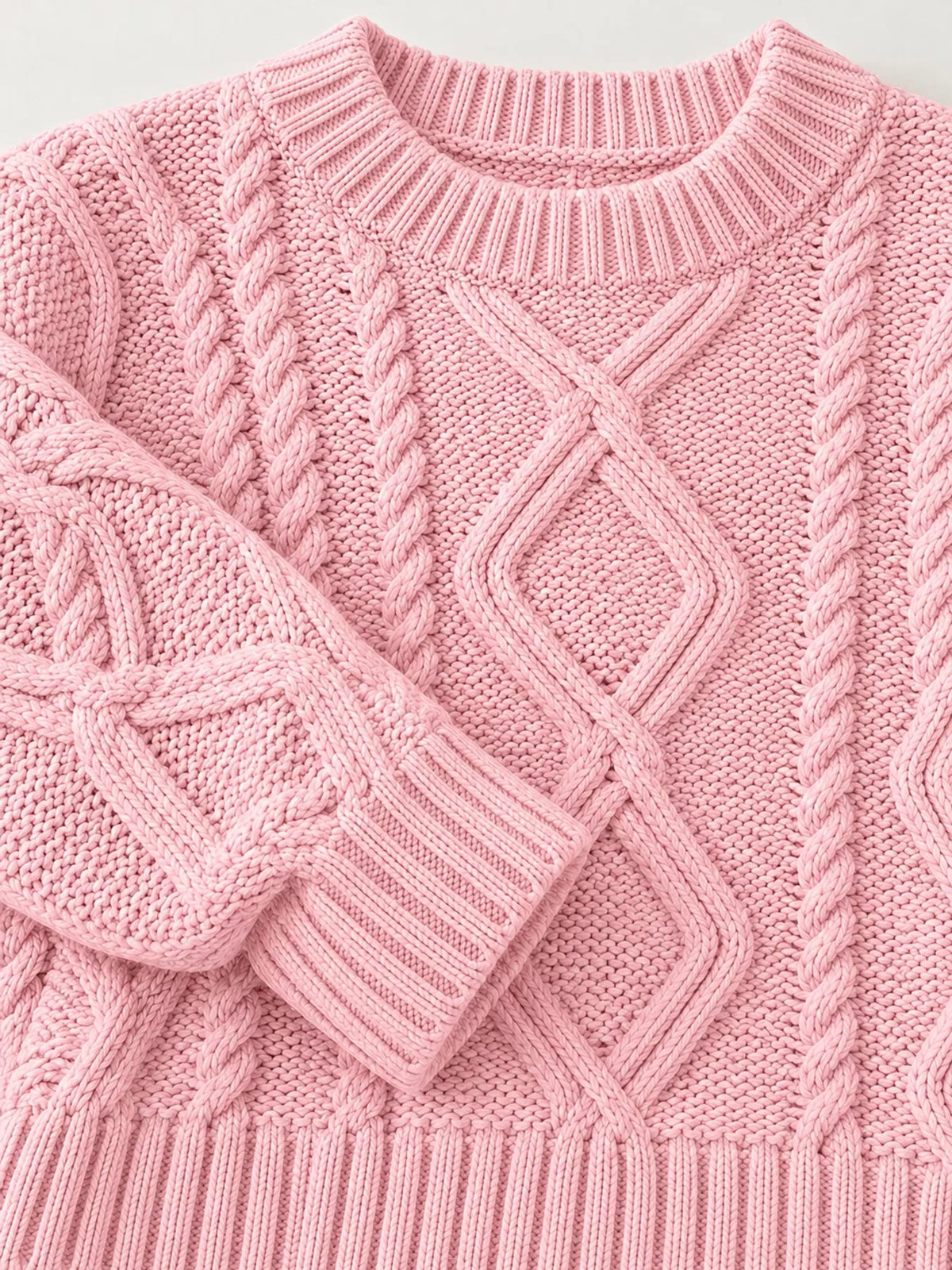 Pink cable-knit round neck sweater, detail view