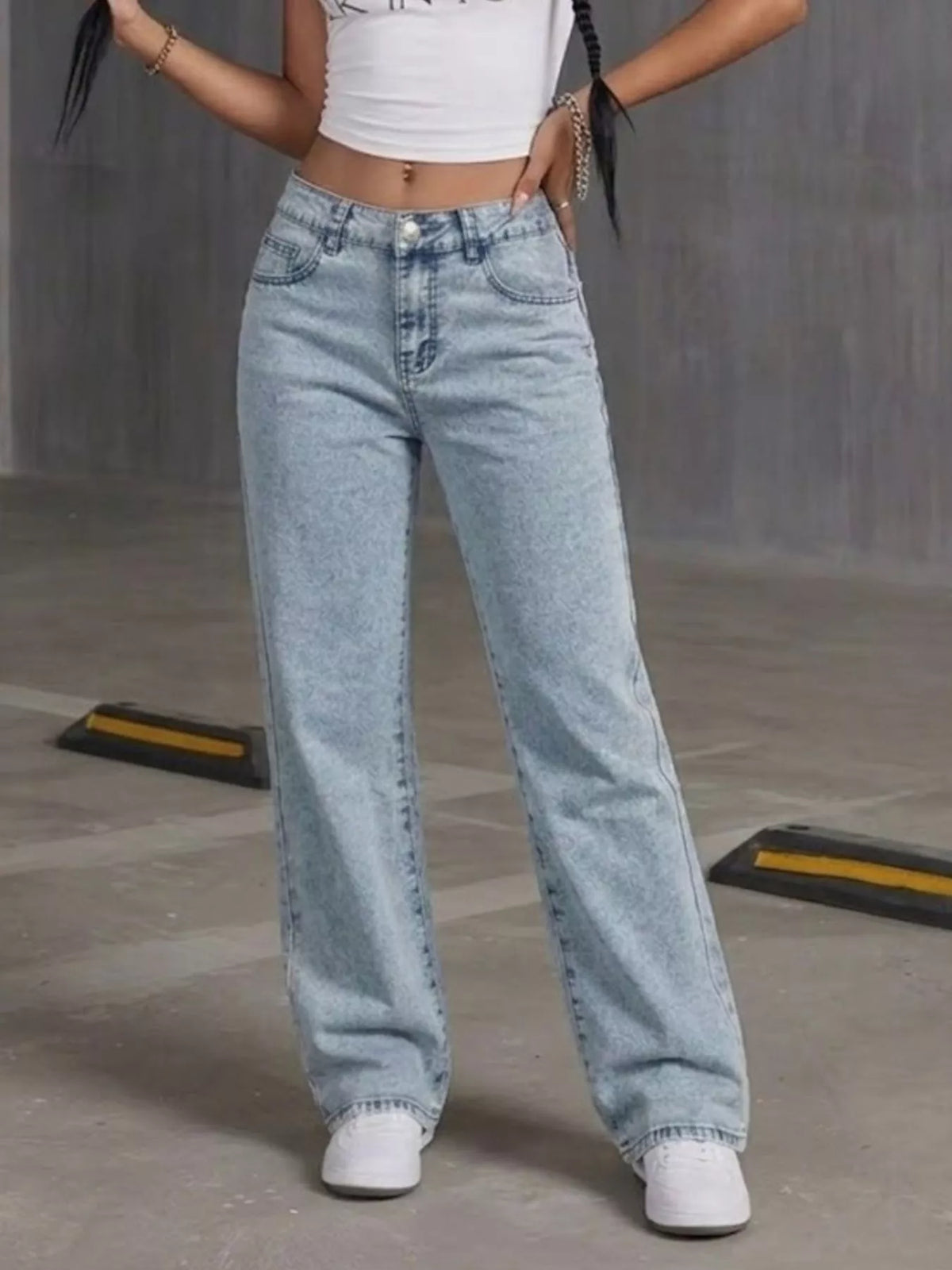 Light blue high-waisted acid-wash straight-leg jeans, front view.