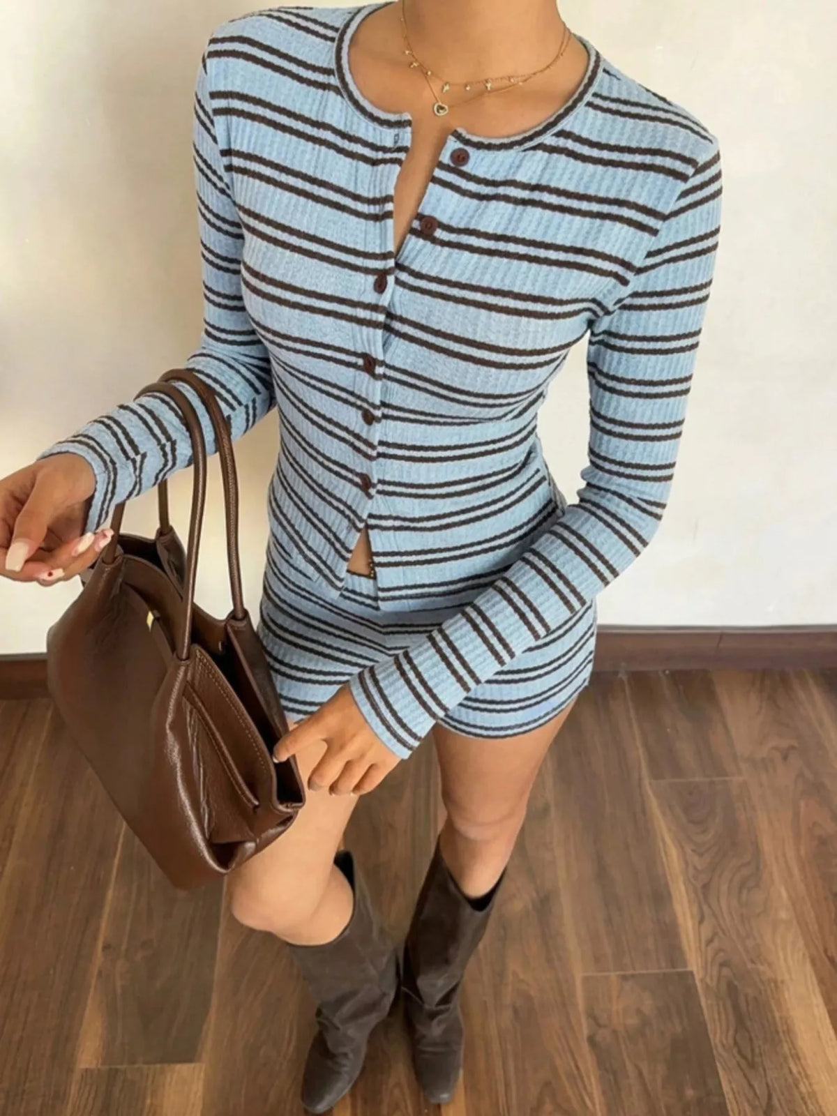 Striped cardigan and shorts set in light blue, angled front view