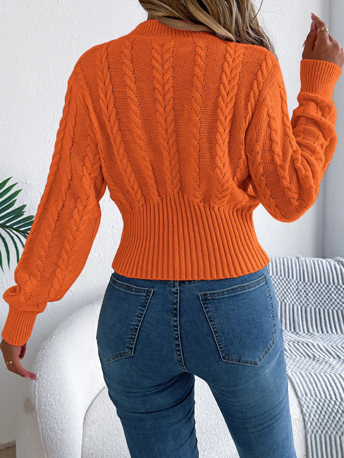 Cable knit mock neck sweater, back view