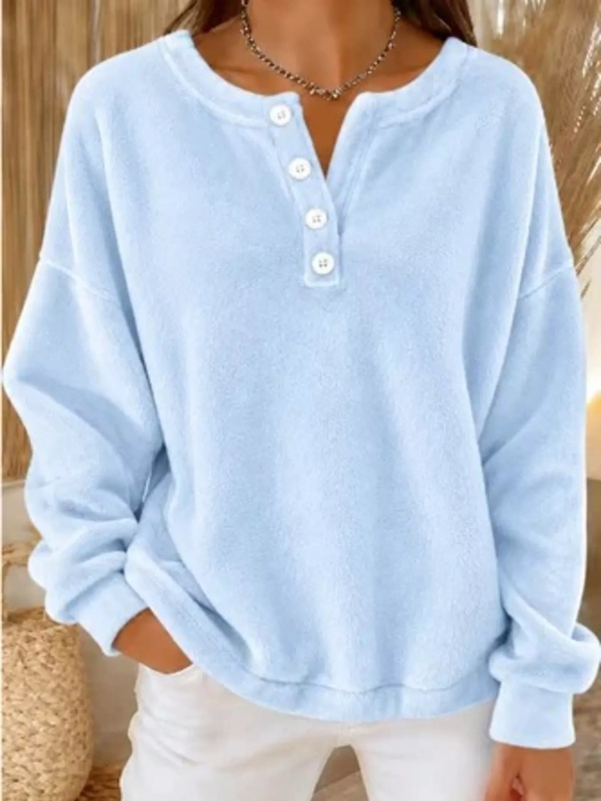 Light blue button-detail dropped shoulder sweatshirt, front view
