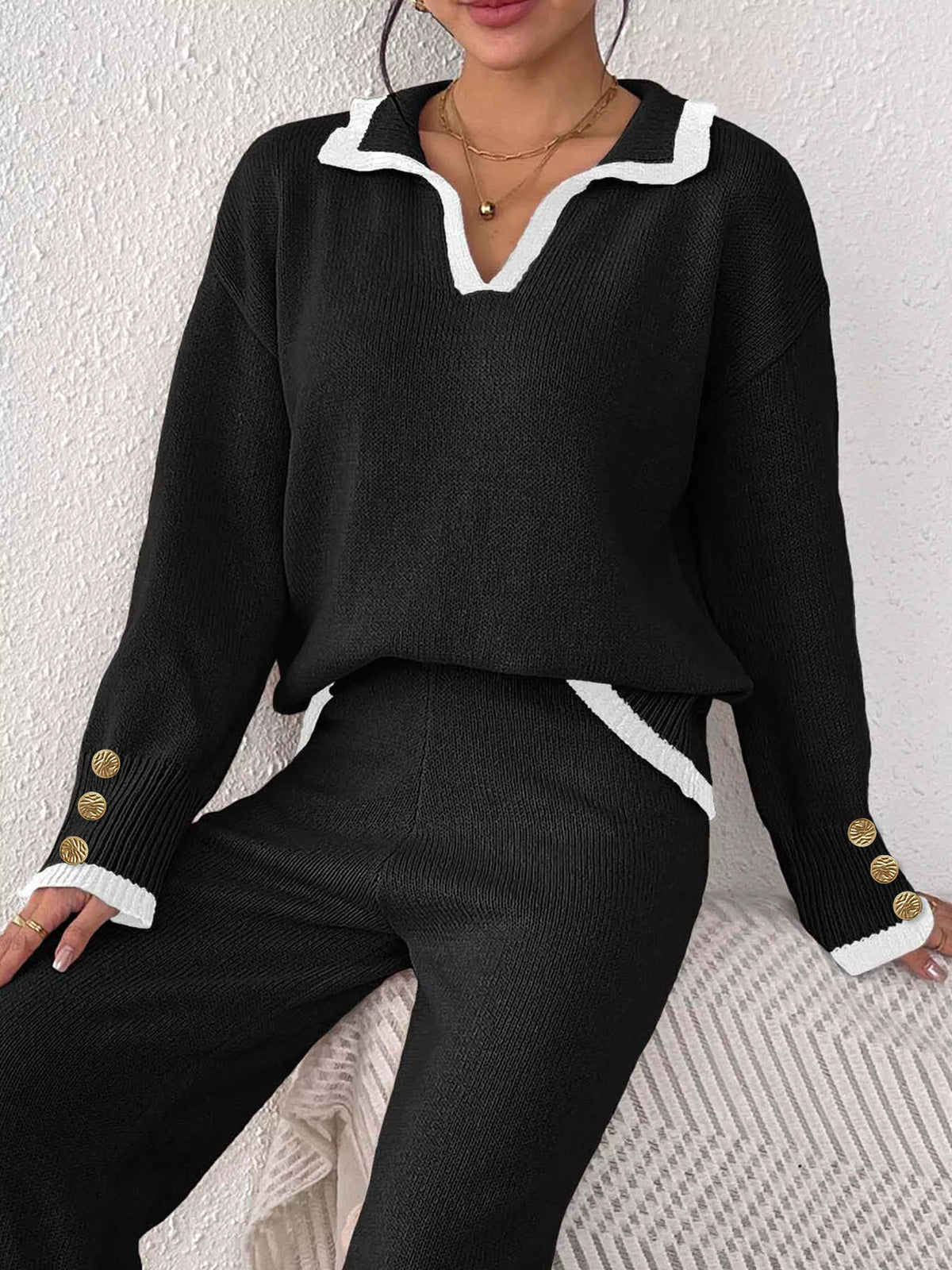 Black contrast-trim polo collar sweater, seated view