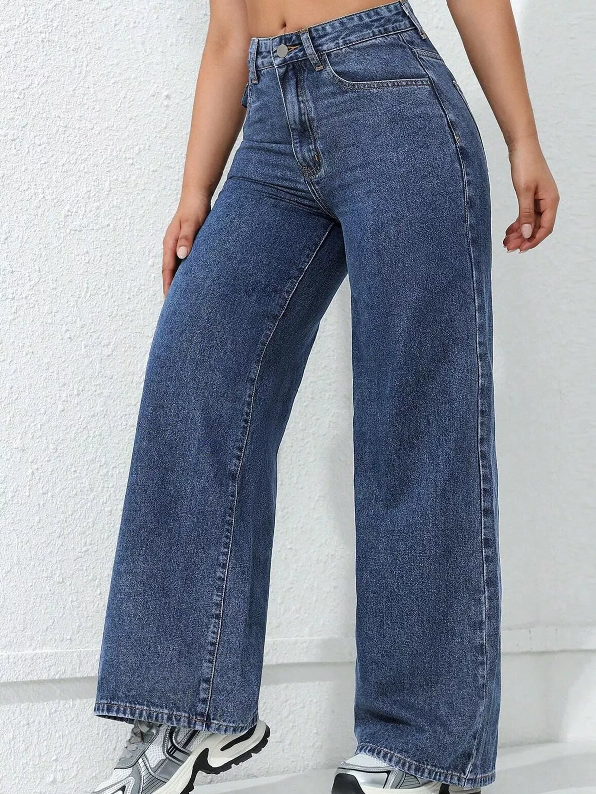 Blue high waisted wide leg jeans, side view
