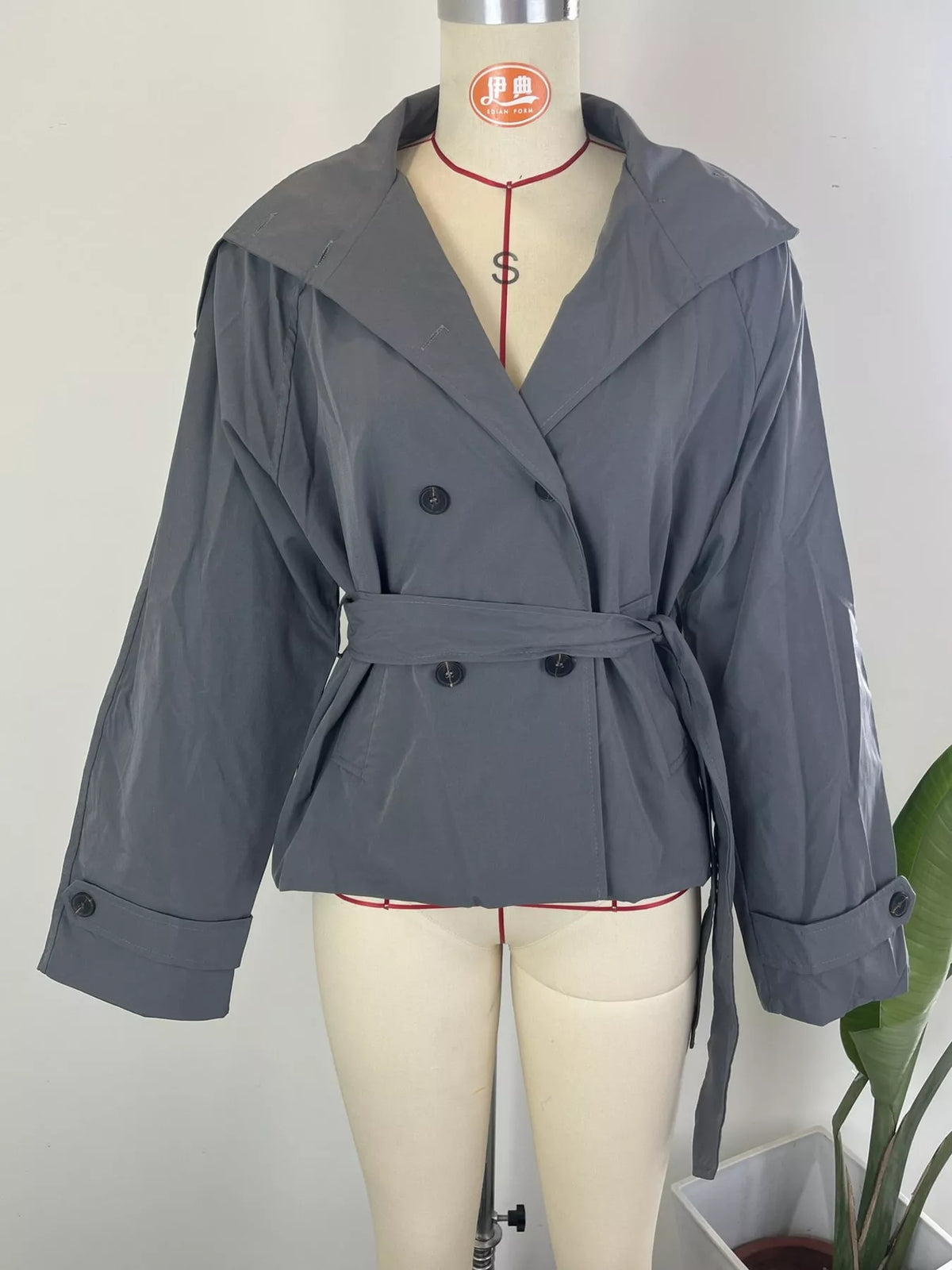 Women's Double-Breasted Belted Trench Coat in gray — mannequin front view