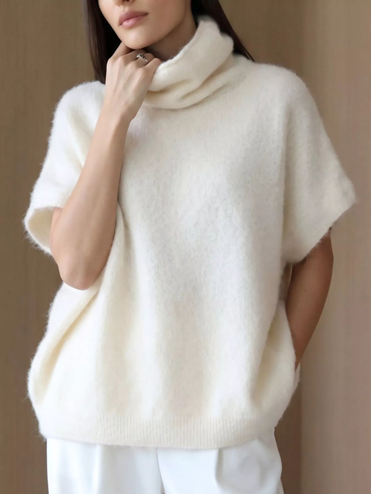 Fuzzy short-sleeve turtleneck sweater in cream, front neckline view