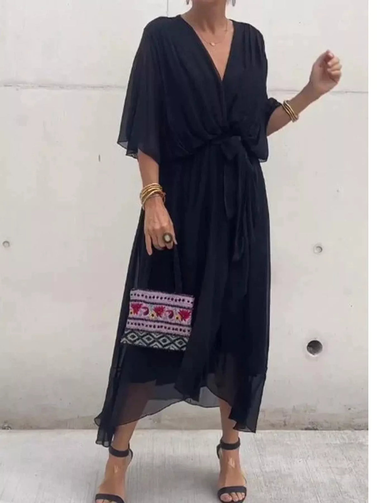 Black batwing sleeve wrap dress with waist tie, front view