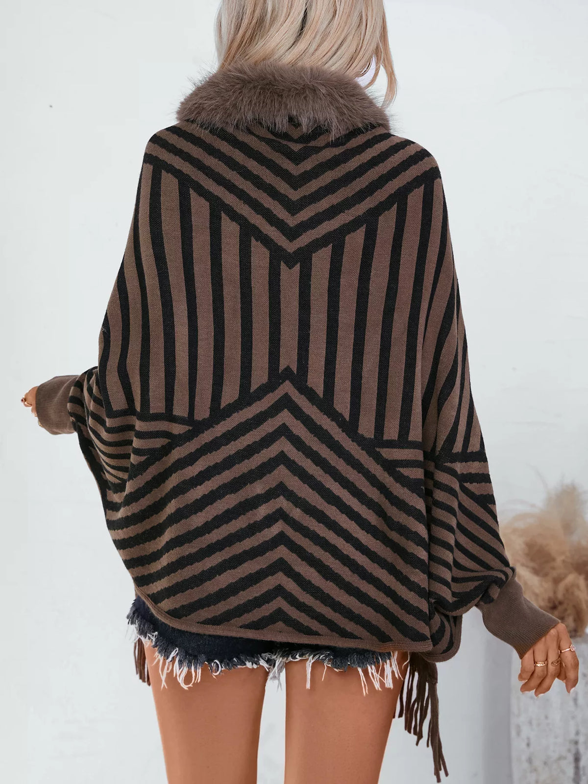 Faux Fur Trimmed Striped Knit Fringe Poncho, back view in brown and black