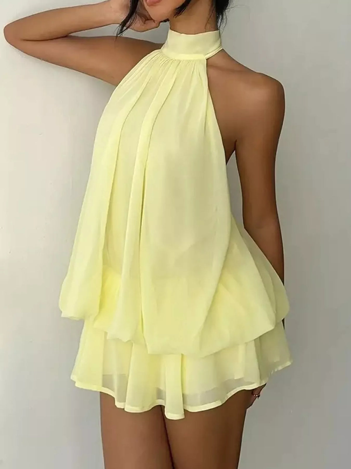 Yellow halter neck layered mini dress, halter neckline view