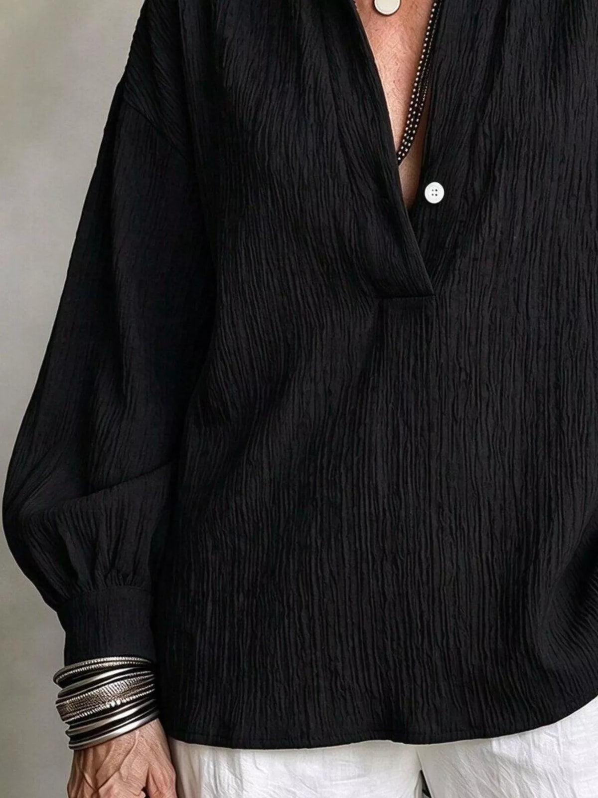 Women's Textured Lantern Sleeves Blouse in black — neckline detail view