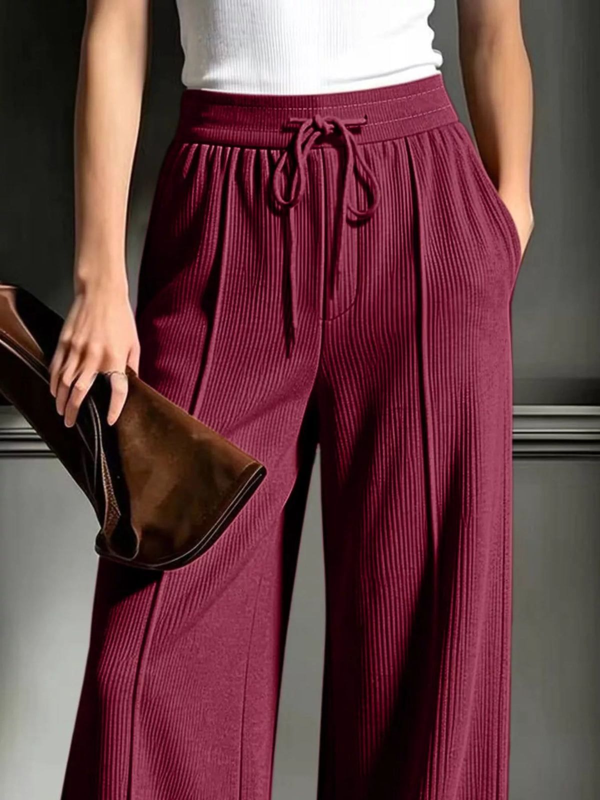 Burgundy wide-leg ribbed corduroy pants, drawstring waistband and side pockets