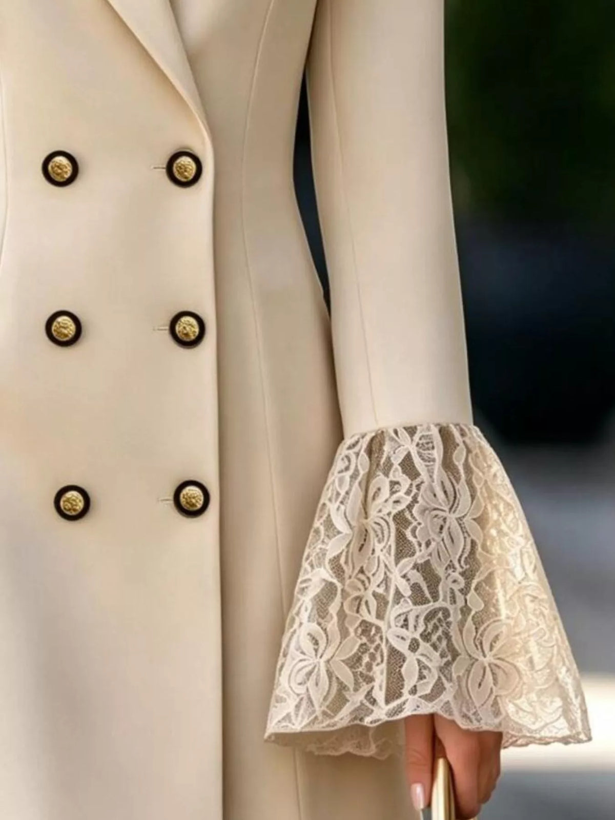 Beige double-breasted blazer dress with lace flare cuffs, detail view