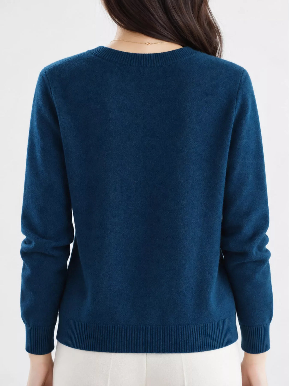 Dark blue crew neck button-front cardigan, back view