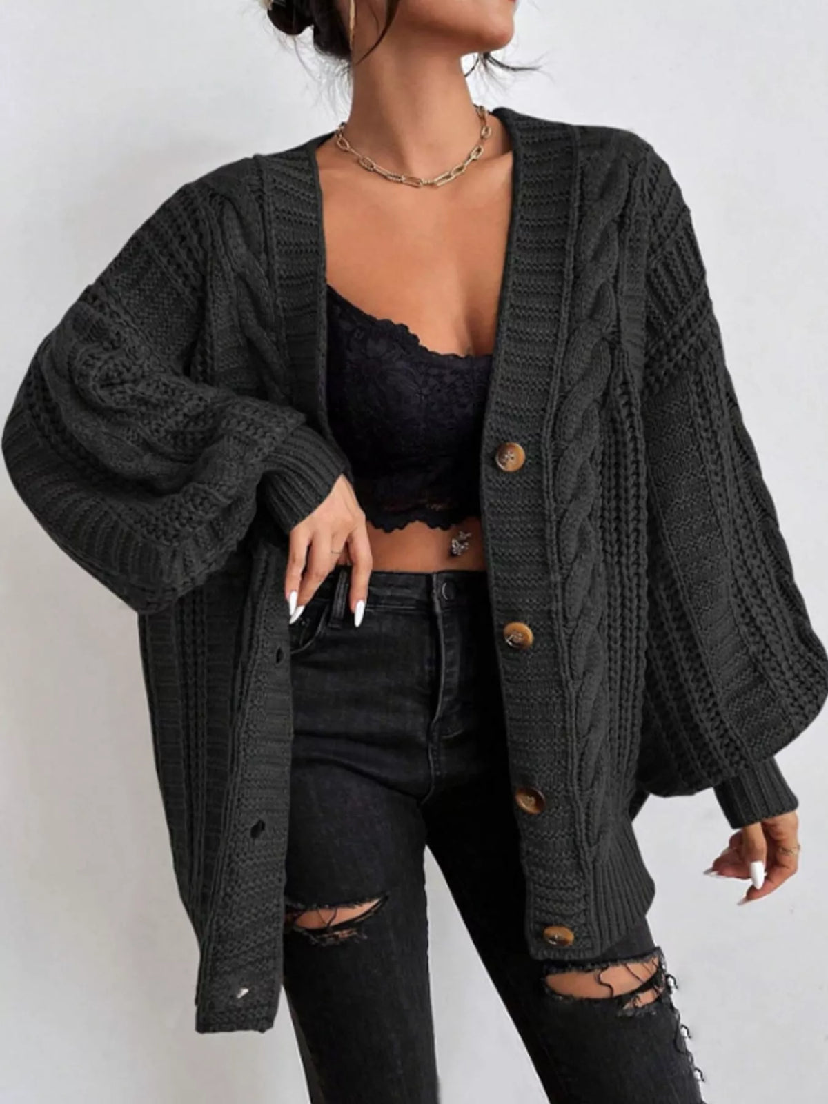 Black cable knit button-down cardigan