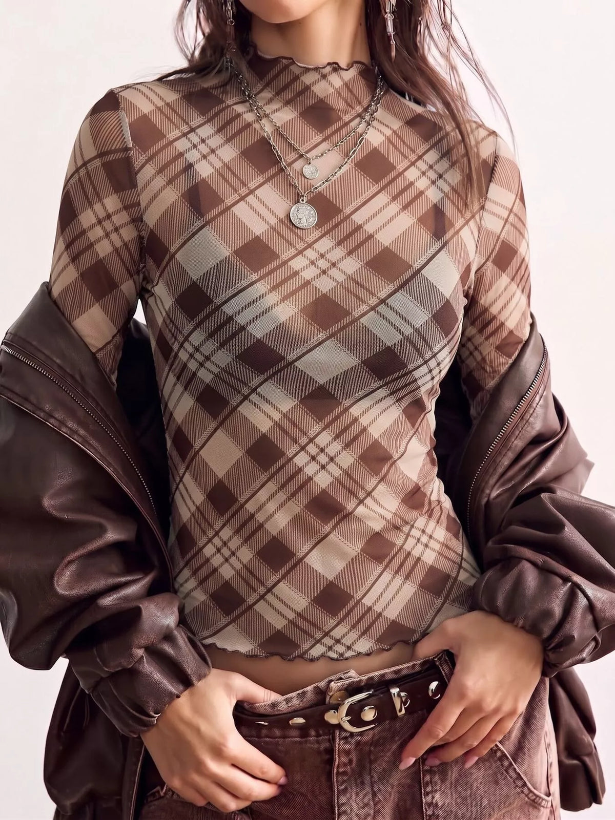 Brown sheer plaid mock-neck top, front neckline view