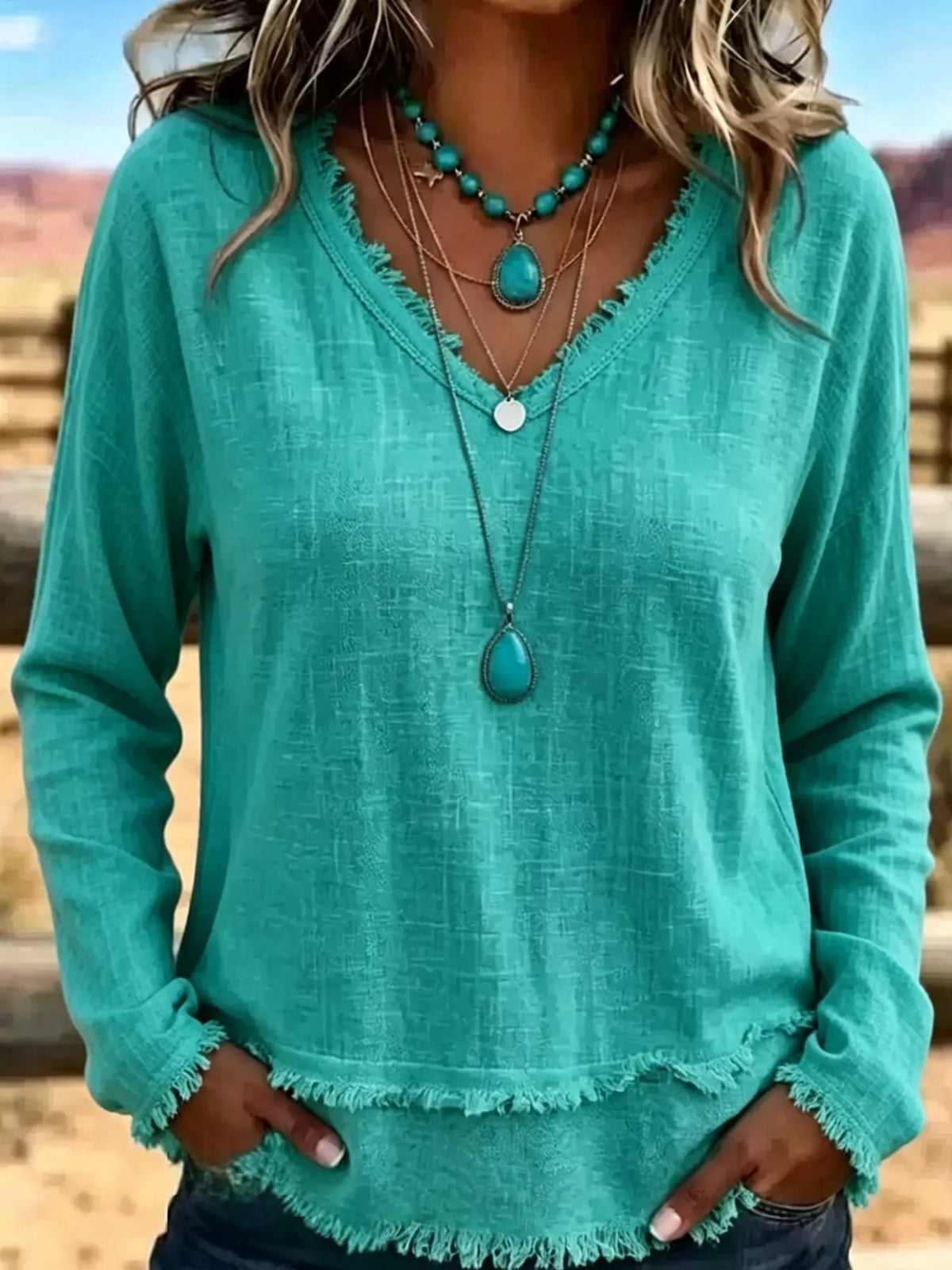 Frayed-hem blouse, teal front on model