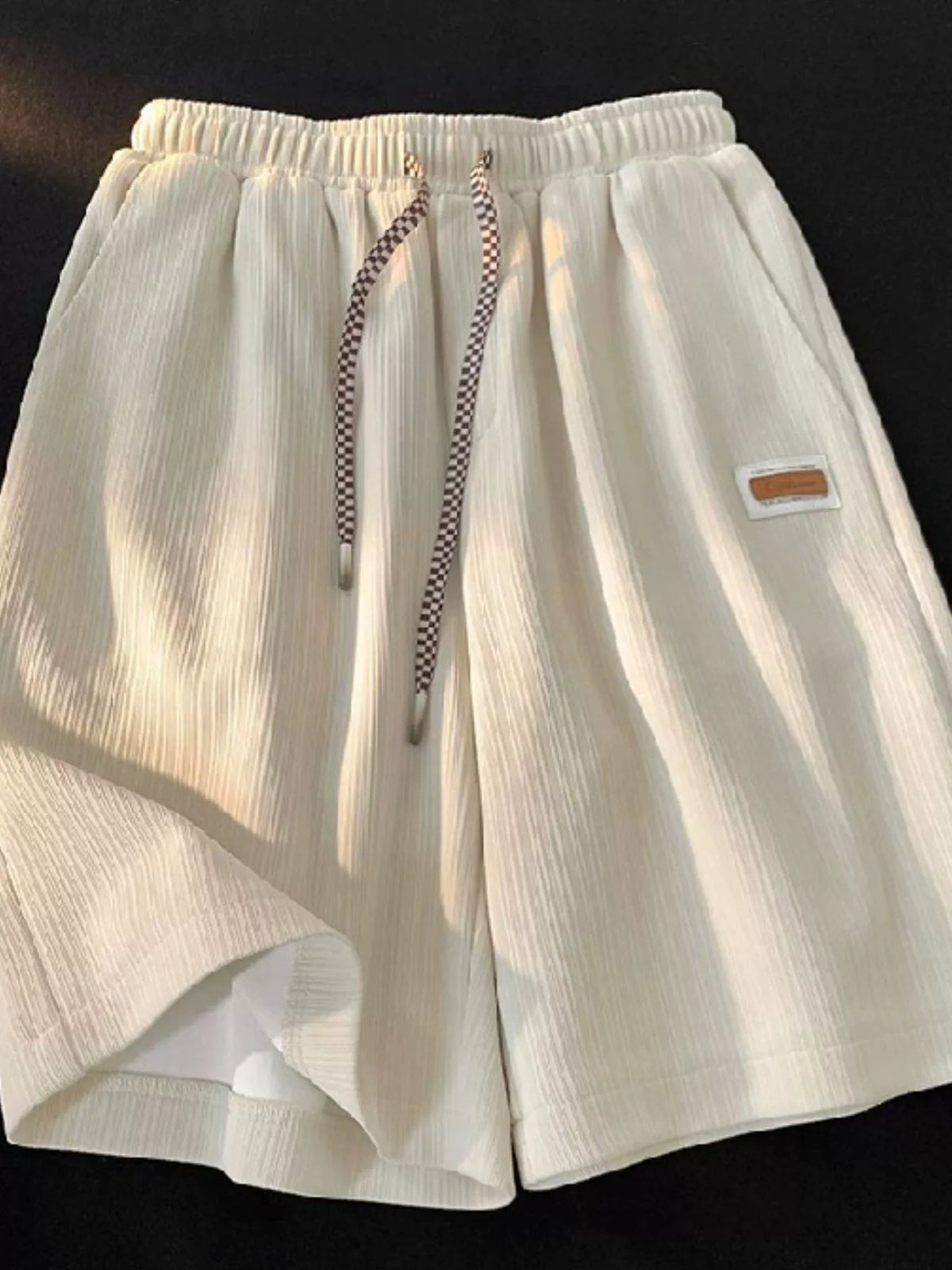 Women's Textured Drawstring Casual Shorts in cream — flat lay view