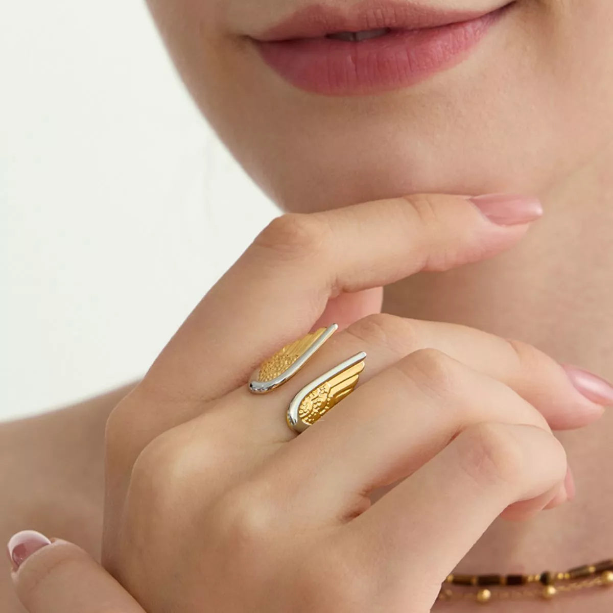 Open Wing Ring, shown worn
