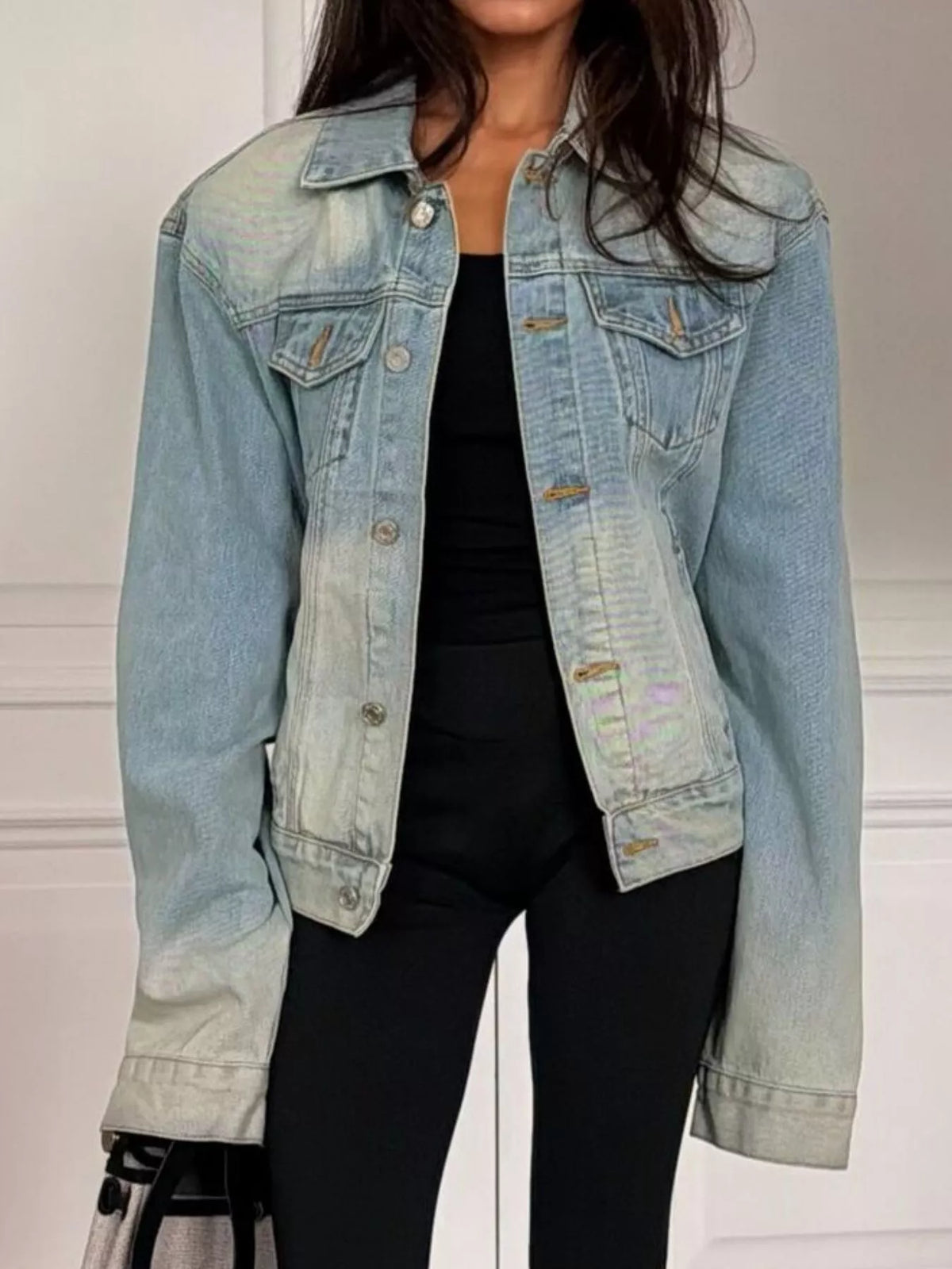 Light blue washed belted denim jacket, front view unbelted.
