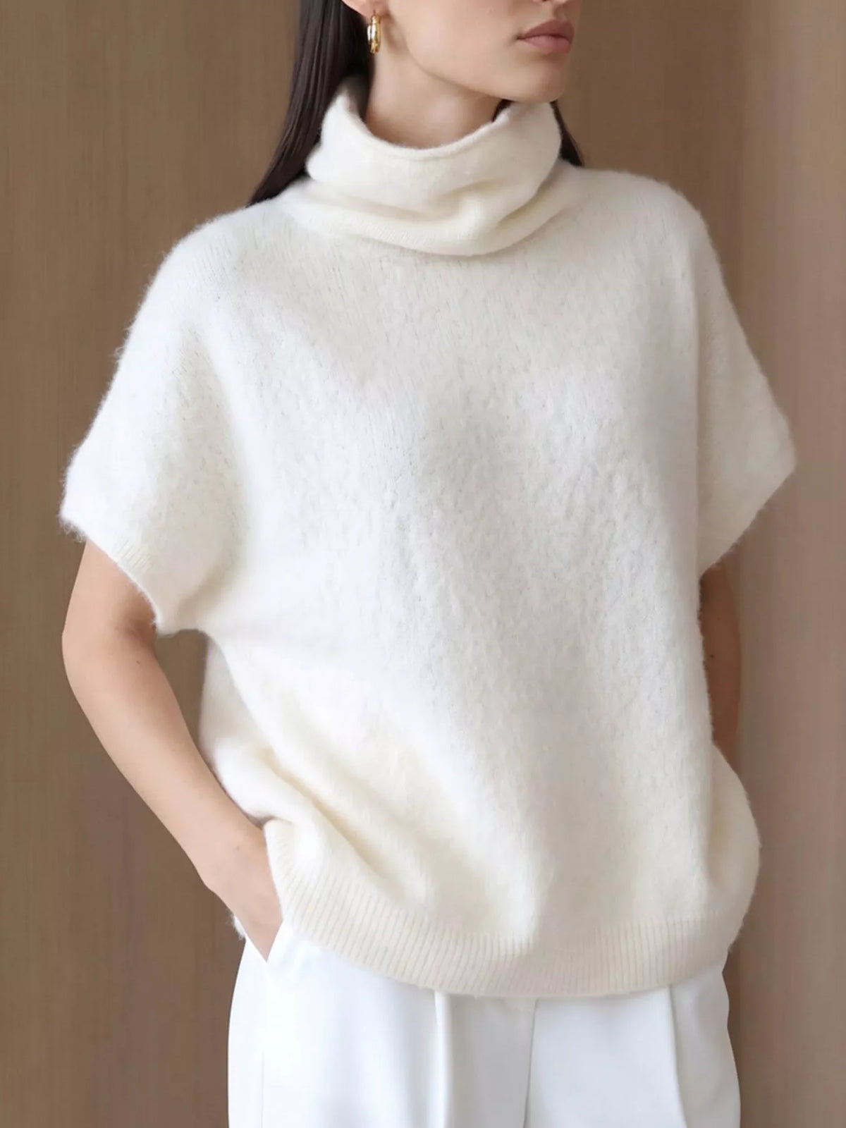 Fuzzy short-sleeve turtleneck sweater in cream, angled front view