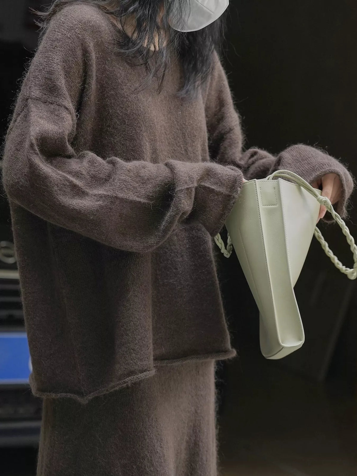 Brown round neck sweater, side view